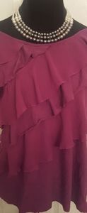Pretty ruffled shirt.